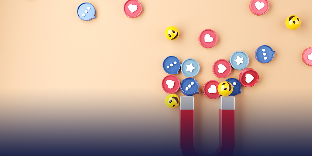 Um imã em formato de U atraindo ícones como emoji sorridente, balão com reticências, estrelas representado "favorito" e corações de "like".